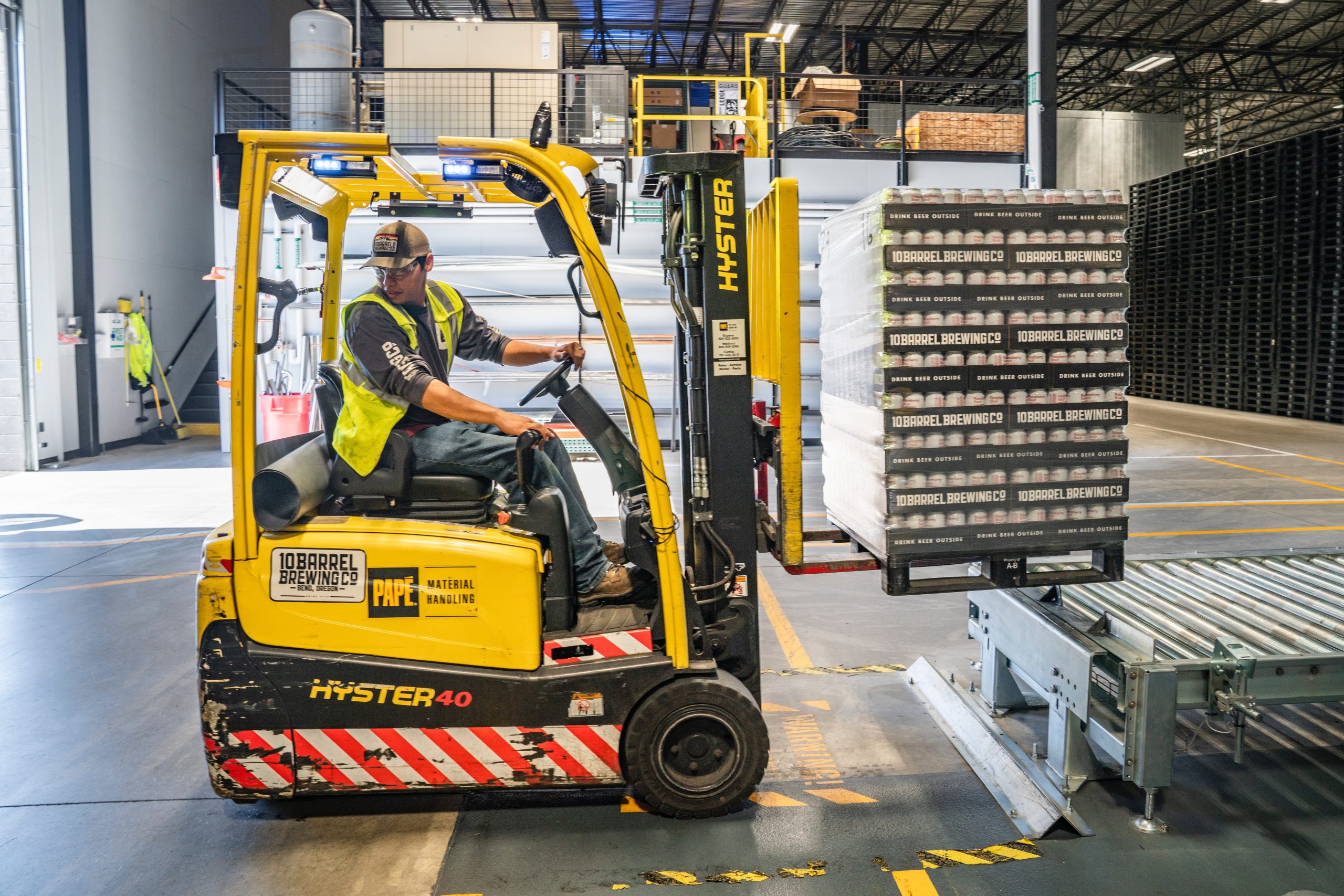 Distribution worker using a forklift in a warehouse